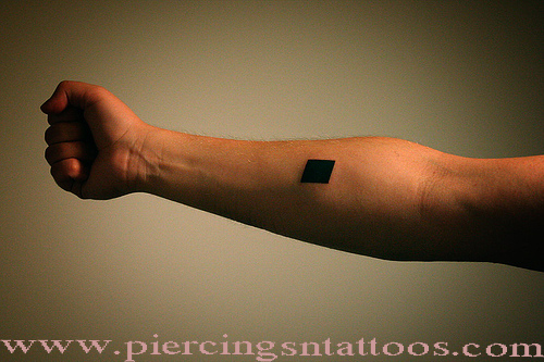 Square tattoo on forearm